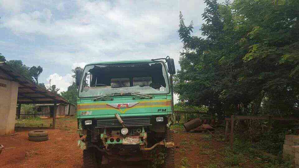 Truck windowshield destroyed by bullets.